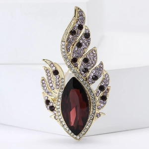 Exquisite vintage wing brooch with deep red marquise stone and purple rhinestones
