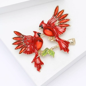Elegant pair of red cardinal bird brooches with rhinestones on gold branches