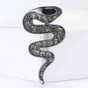 Detailed view of snake brooch featuring gunmetal alloy and shimmering grey rhinestones