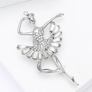 Detail of ballerina brooch featuring crystal rhinestones on a silver metal base