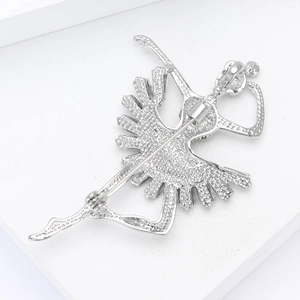 Detailed back view of the ballet dancer brooch showing pin fastener and metal texture