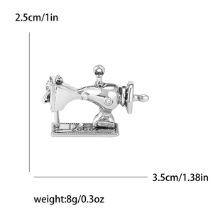 Detail view of a vintage sewing machine brooch with dimensions 2.5cm height and 3.5cm width