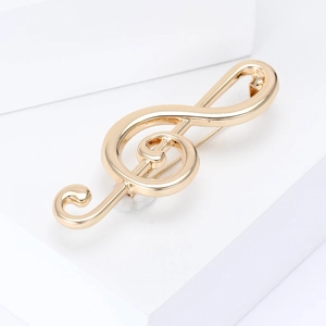 Élégante broche clé de sol dorée polie pour costumes et manteaux chic