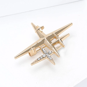 Broche avion étoile dorée exquise avec strass pour tailleur et manteau pour femme