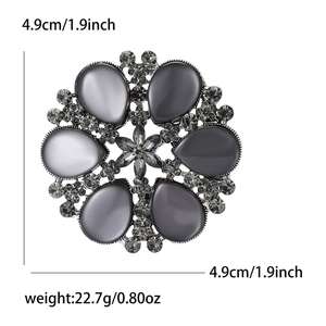 Vintage flower brooch with grey cat eye stones and rhinestones, 4.9cm diameter