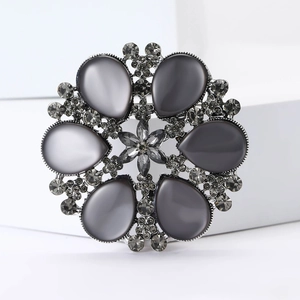 Vintage snowflake cat eye stone brooch with grey rhinestones on a silver alloy base