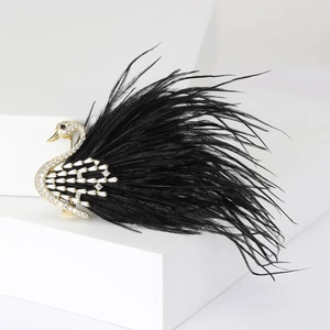 Elegant luxury copper swan brooch with glittering cubic zirconia and black feather accents