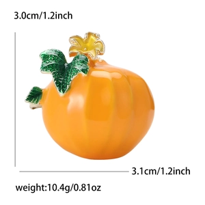 Creativa spilla a forma di zucca in smalto arancione con foglie verdi e fiore giallo