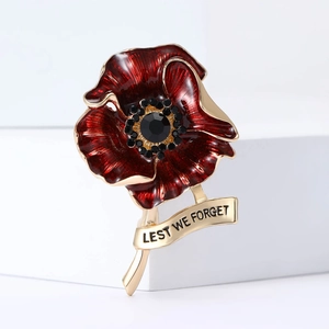 Poppy flower brooch in red enamel with black crystal and 'LEST WE FORGET' engraving