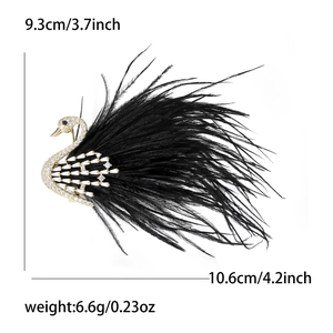 Elegant swan brooch in gold copper with white zircons and black feather details