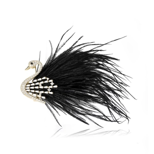 Luxurious swan brooch with gold metal, sparkling cubic zirconia and black feathers
