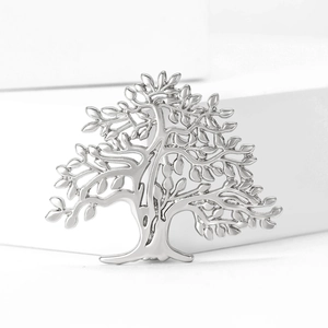 Polished silver alloy tree of life brooch pin with hollow design on white stairs