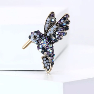 Exquisite hummingbird brooch with colorful rhinestones on a gold alloy base