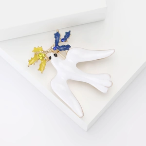 Elegante spilla colomba della pace in smalto bianco con rami di ulivo in zircone