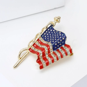 Elegant US flag brooch with golden frame, enamel colors, and sparkling rhinestones
