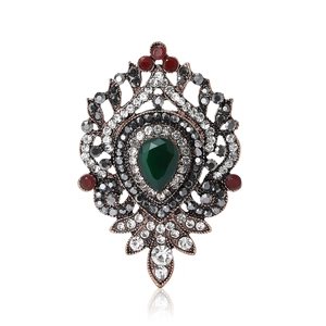 Vintage bronze alloy brooch with dark green teardrop gemstone and grey rhinestones