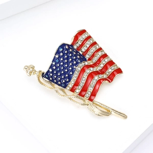 Detail of American flag brooch with red blue enamel and sparkling rhinestones