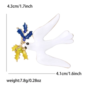 Spilla colomba in smalto bianco con strass blu, dimensioni 4,3 cm x 4,1 cm in mostra