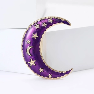 Elegant crescent moon brooch in purple enamel and gold finish with sparkling stars