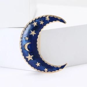 Elegant gold metal crescent moon brooch with dark blue enamel and sparkling crystal stars