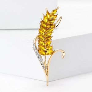 Élégante broche blé en or avec cristaux jaunes et accents blancs scintillants