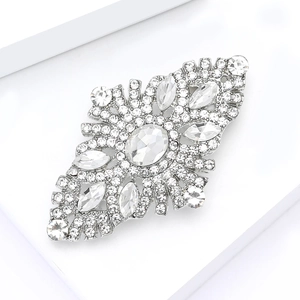 Detailed macro view of vintage alloy brooch with sparkling rhinestones and crystal inlay