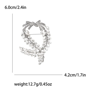 Silver wheat wreath brooch with bow and crystals, measuring 6.0cm x 4.2cm and weighing 12.7g