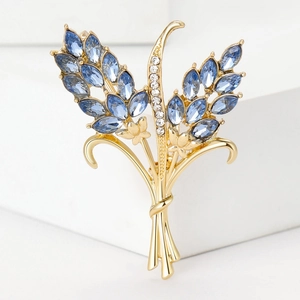 Elegant wheat ear brooch with blue crystal leaves and white rhinestones on gold metal base