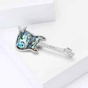Elegant guitar brooch with abalone shell inlay and rhinestone butterfly on silver alloy