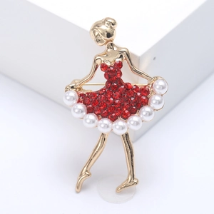 Elegante spilla da ballerina in oro con strass rossi e dettaglio gonna in perle bianche