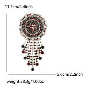 Vintage round rhinestone brooch with crystal fringe tassel and antique metal finish