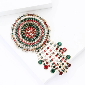 Luxury gold alloy round brooch with red, green, and white rhinestones and tassel fringe