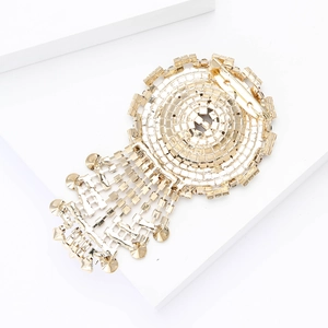 Back view of a high-end vintage gold tassel brooch with round crystal chain and pin clasp