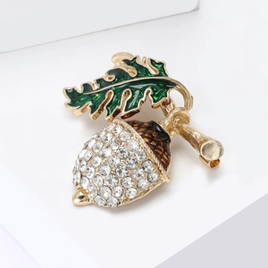 Creative chestnut brooch with sparkling rhinestones and green enamel leaves in gold finish