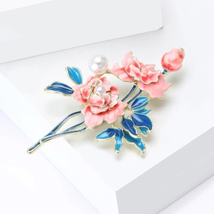 Elegant enamel peony flower brooch with pearls and blue leaves on white stand