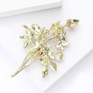 Elegant gold peony brooch with pearl and red enamel detail, back view structure