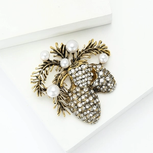 Elegant gold alloy pinecone brooch with sparkling rhinestones and white pearls
