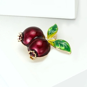 Elegant gold-plated pomegranate enamel brooch with deep red fruit and green leaves