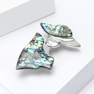 Elegant silver alloy brooch featuring a shell-inlaid lady silhouette for suits and coats