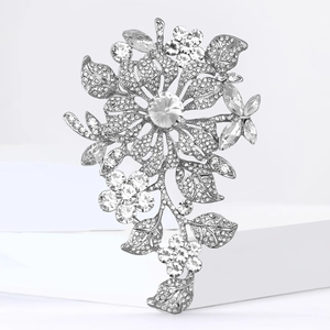 Detail of silver alloy brooch with sparkling crystal floral and marquise rhinestones
