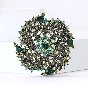 Broche couronne vintage élégante avec strass verts et motif d'épis de blé sur base bronze