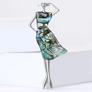 Elegant silver lady brooch with iridescent shell dress on a clean white background