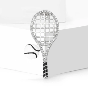 Fashion tennis racket brooch with clear rhinestones and white ball on a geometric stand