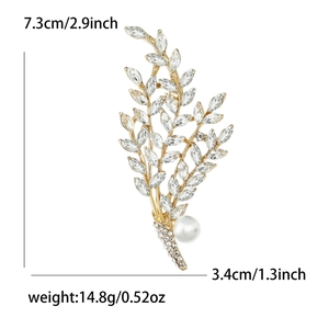 Elegant gold willow branch brooch with crystal rhinestones and a white pearl accent