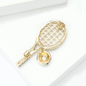 Detail view of rhinestone tennis racket brooch back showing the secure safety pin clasp