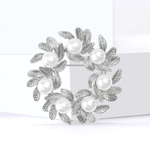 Elegant silver alloy wreath brooch with white pearls and detailed leaf textures for women