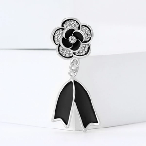 Luxury camellia brooch in black enamel and silver with white zircon pavé details