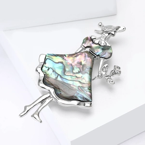 Elegant girl brooch featuring colorful shell inlay on a silver metal gown design