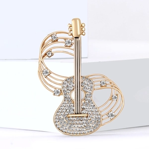 Creative gold guitar brooch with sparkling crystals and musical note flowing lines