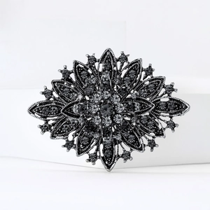 Elegant vintage silver floral brooch with dark gray rhinestones for women accessories